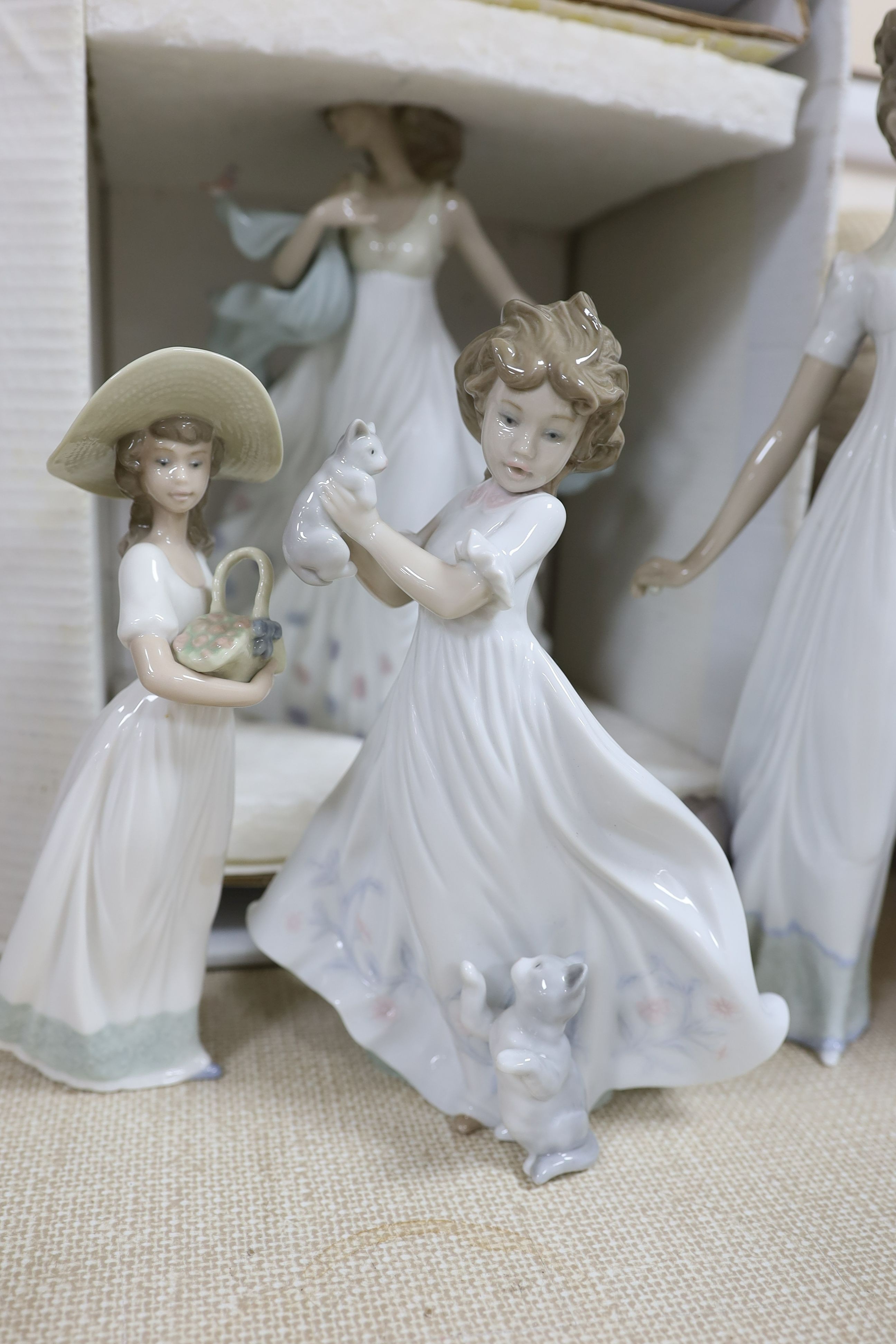 A selection of Lladro and Nao figures